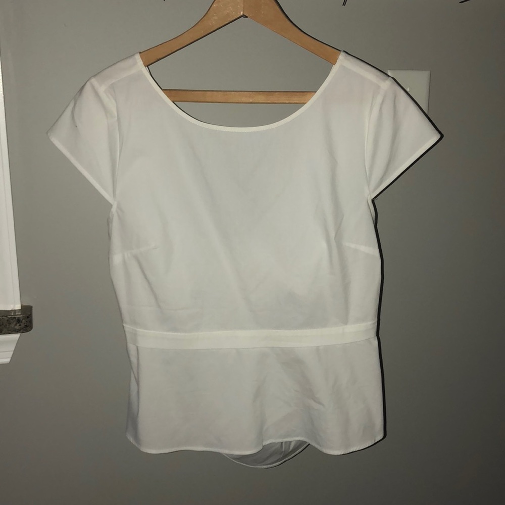 Peplum bow back top